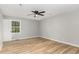 Bright bedroom with wood-look floors and ceiling fan at 2113 Eveton Ln, Sanford, NC 27330