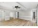 Spacious bedroom with mirrored closet doors and hardwood floors at 2113 Eveton Ln, Sanford, NC 27330