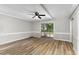 Living room with ceiling fan and sliding glass doors to balcony at 2113 Eveton Ln, Sanford, NC 27330