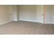 Spacious bedroom with carpeted floor and doors at 84 Rosslyn Way # 92, Garner, NC 27529