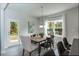 Bright dining area with wood table and access to backyard at 84 Rosslyn Way # 92, Garner, NC 27529