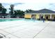 Community pool with a water feature and lounge area at 608 Nemesia Dr, Wendell, NC 27591