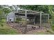 Chicken coop with wire enclosure and hens at 11609 Us-401, Fuquay Varina, NC 27526