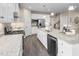 Modern kitchen with granite countertops, stainless steel appliances, and hardwood floor at 1025 Country Pasture Cv, Wendell, NC 27591