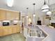 Kitchen with large island, double sinks, and views into living room at 107 Knottingham Ct, Dunn, NC 28334