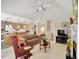 Open living room with vaulted ceiling, fireplace, and kitchen views at 107 Knottingham Ct, Dunn, NC 28334