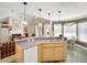 Eat-in kitchen with island, double sinks, and bright windows at 107 Knottingham Ct, Dunn, NC 28334
