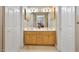 Double vanity bathroom with light wood cabinets and updated fixtures at 107 Knottingham Ct, Dunn, NC 28334