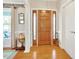 Bright entryway with hardwood floors and a globe at 107 Knottingham Ct, Dunn, NC 28334