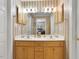 Clean bathroom with double sinks and updated light fixtures at 107 Knottingham Ct, Dunn, NC 28334