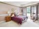 Bright bedroom with a charming rocking chair and large window at 107 Knottingham Ct, Dunn, NC 28334
