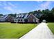 Brick house with long driveway and landscaped lawn at 107 Knottingham Ct, Dunn, NC 28334