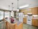 Spacious kitchen with island, ample cabinetry, and breakfast nook at 107 Knottingham Ct, Dunn, NC 28334