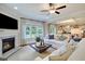 Living room with fireplace, large windows and comfortable seating at 95 Bold Dr, Youngsville, NC 27596