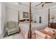 Large bedroom with a post bed, comfortable seating, and large windows at 3105 W Hampton Dr, Rocky Mount, NC 27804