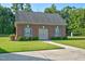 Detached brick storage building with double doors and window shutters at 3105 W Hampton Dr, Rocky Mount, NC 27804