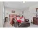 Charming bedroom with a queen bed and leather seating at 3105 W Hampton Dr, Rocky Mount, NC 27804