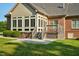 Brick home with sunroom and wooden deck at 3105 W Hampton Dr, Rocky Mount, NC 27804