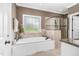 Bathroom with a large soaking tub and walk-in shower at 3105 W Hampton Dr, Rocky Mount, NC 27804
