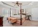 Spacious Primary bedroom with a post bed and plenty of natural light at 3105 W Hampton Dr, Rocky Mount, NC 27804