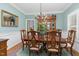 Formal dining room with hardwood floors, chandelier, and wainscoting at 3105 W Hampton Dr, Rocky Mount, NC 27804
