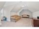 Spacious bonus room with two sofas and a work desk at 3105 W Hampton Dr, Rocky Mount, NC 27804