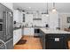 Modern kitchen with island, stainless steel appliances, and hardwood floors at 3105 W Hampton Dr, Rocky Mount, NC 27804