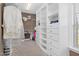Bright walk-in closet with ample shelving and hanging space at 3105 W Hampton Dr, Rocky Mount, NC 27804