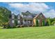 Brick house exterior with lush lawn and landscaping at 3105 W Hampton Dr, Rocky Mount, NC 27804