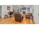 Spacious living room with hardwood floors, fireplace, and built-in shelving at 3105 W Hampton Dr, Rocky Mount, NC 27804