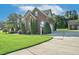 Brick house exterior with driveway and landscaping at 3105 W Hampton Dr, Rocky Mount, NC 27804