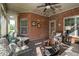 Bright sunroom with brick walls and wicker furniture at 3105 W Hampton Dr, Rocky Mount, NC 27804