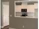 View of a kitchen with white cabinets and granite countertops at 35 Courtland Dr, Louisburg, NC 27549