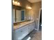 Double vanity with granite countertop and white cabinets in bathroom at 35 Courtland Dr, Louisburg, NC 27549