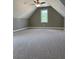 Spacious bonus room with carpeted floor and ceiling fan at 35 Courtland Dr, Louisburg, NC 27549