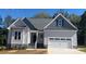 One-story house with gray siding, gray roof, and a two-car garage at 35 Courtland Dr, Louisburg, NC 27549
