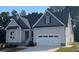 Two-story house with gray siding, white trim, and a gray roof at 35 Courtland Dr, Louisburg, NC 27549