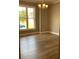 Bright dining room with hardwood floors and a chandelier at 35 Courtland Dr, Louisburg, NC 27549