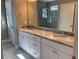 Double vanity with granite countertop and white cabinets in bathroom at 35 Courtland Dr, Louisburg, NC 27549