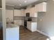 White cabinets, granite countertops and stainless steel appliances in this kitchen at 35 Courtland Dr, Louisburg, NC 27549
