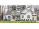 Two-story craftsman style home with white siding and gray roof at 4808 Glen Forest Dr, Raleigh, NC 27612