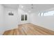 Bright bedroom with hardwood floors and multiple windows at 2708 A Ashley St, Durham, NC 27704