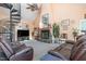 Spacious living room featuring a stone fireplace, spiral staircase, and comfortable seating at 3313 Overhead Ct, Willow Springs, NC 27592