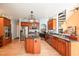 Well-equipped kitchen offering an island, stainless steel appliances, and rich wood cabinets at 3313 Overhead Ct, Willow Springs, NC 27592