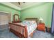 Bright bedroom with a wooden bed frame and peaceful atmosphere at 3313 Overhead Ct, Willow Springs, NC 27592