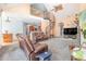 Open living area showcasing a spiral staircase and views into the kitchen at 3313 Overhead Ct, Willow Springs, NC 27592