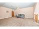 Versatile bonus room with a sofa and neutral color palette at 3313 Overhead Ct, Willow Springs, NC 27592