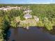 Waterfront property with a large home and detached garage at 3313 Overhead Ct, Willow Springs, NC 27592