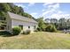Charming cottage-style home with pond views and lush landscaping at 3313 Overhead Ct, Willow Springs, NC 27592