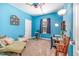 Bright bedroom with blue walls, and plenty of space for a crib and other furniture at 3313 Overhead Ct, Willow Springs, NC 27592